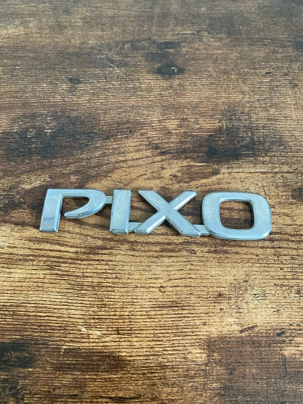 Nissan Pixo car badge emblem logo plastic
