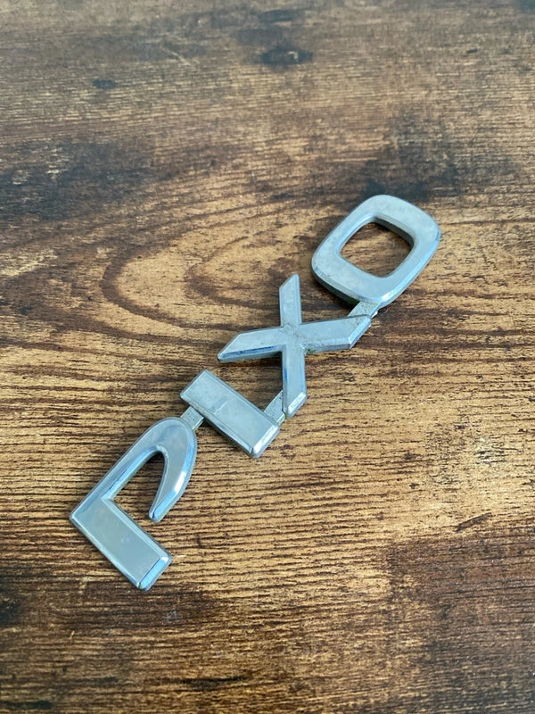 Nissan Pixo car badge emblem logo plastic
