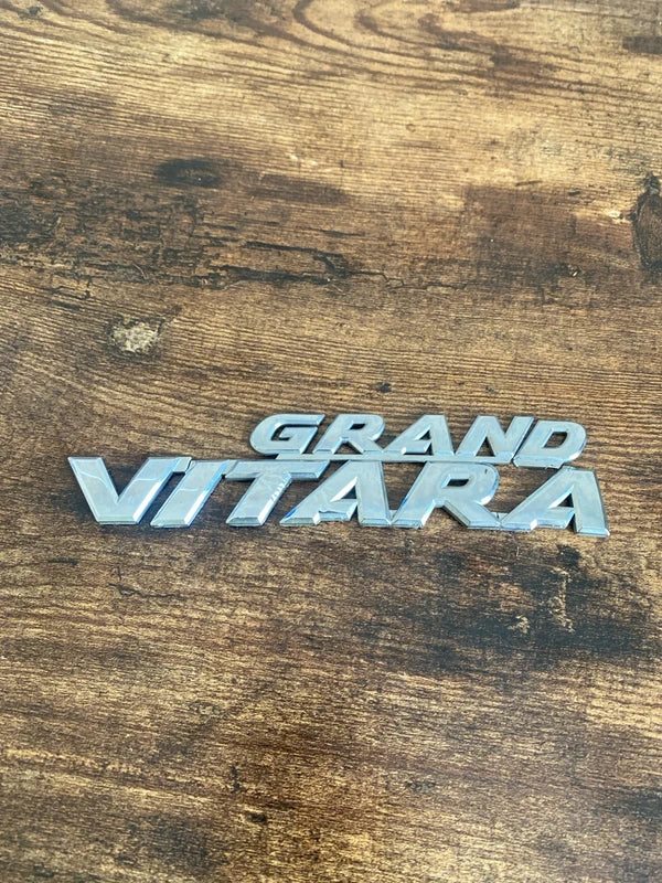 Suzuki Grand Vitara car badge emblem logo