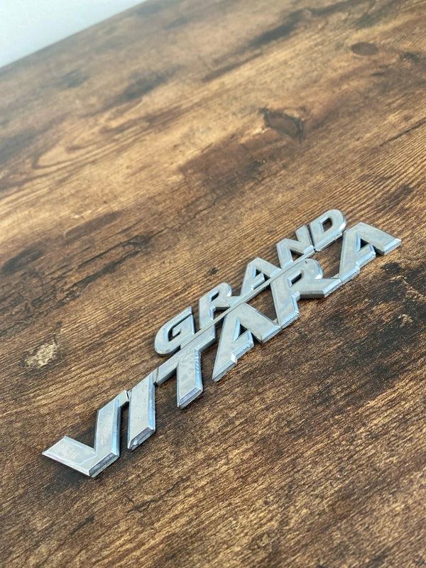 Suzuki Grand Vitara car badge emblem logo