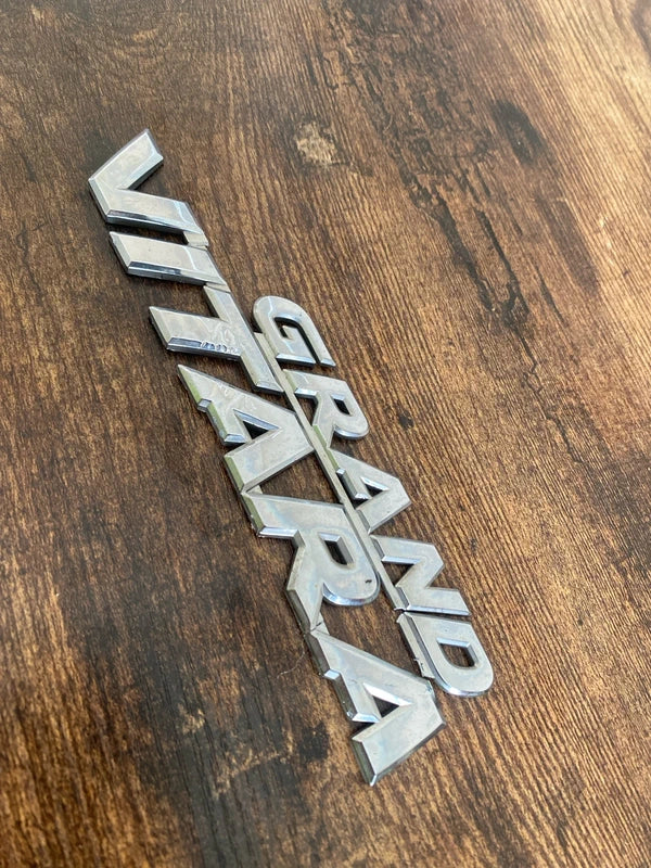 Suzuki Grand Vitara car badge emblem logo