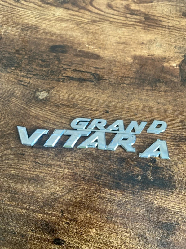 Suzuki Grand Vitara car badge emblem logo