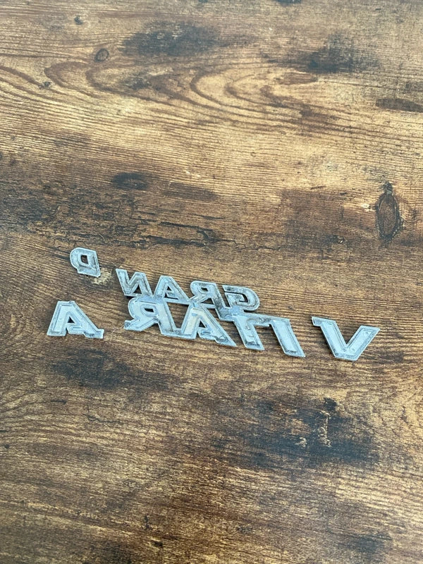 Suzuki Grand Vitara car badge emblem logo