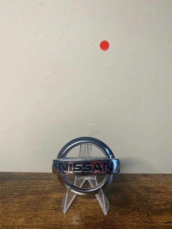 Small Nissan round car badge logo emblem