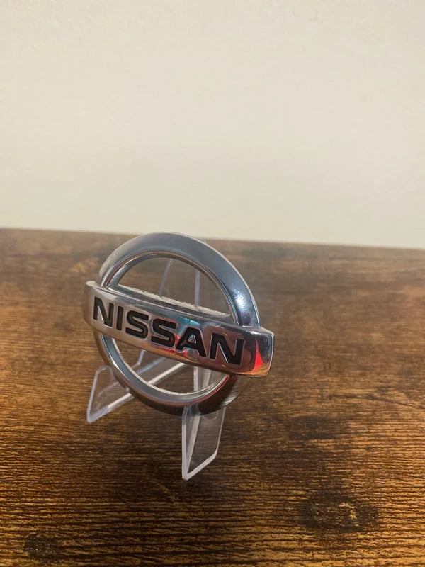 Small Nissan round car badge logo emblem