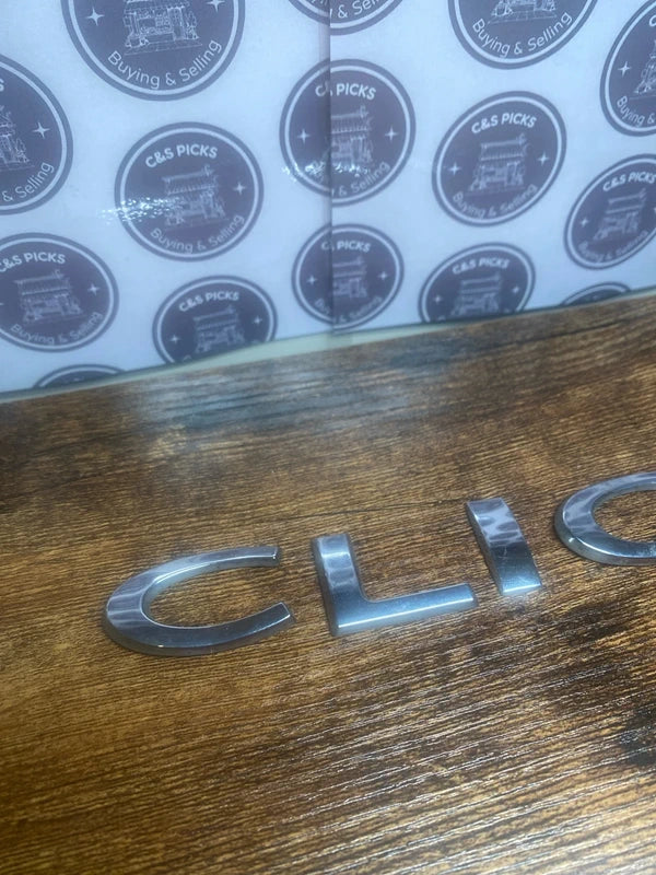 Renault Clio car badge emblem logo script lettering